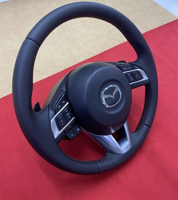 Перетянули руль от Mazda 6 экокожей немецкого производства с псевдоперфорацией