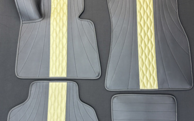 Пошив стильных ковров из экокожи для автомобиля BMW X5 G05